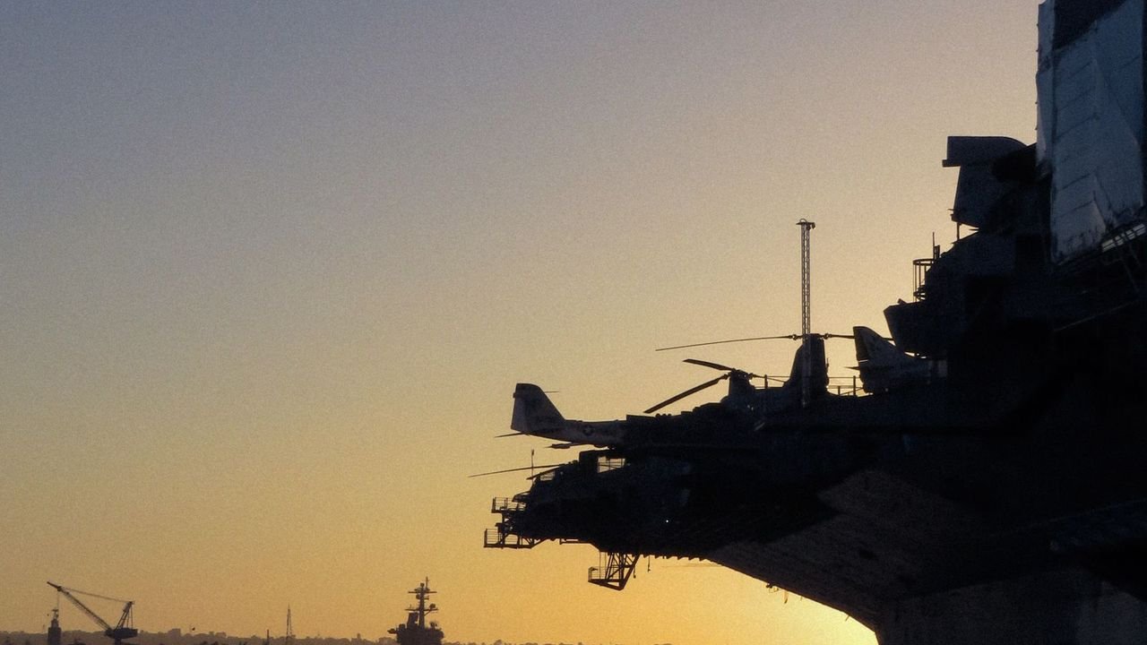 Naval vessel at sunset